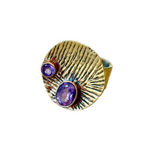 Load image into Gallery viewer, Gold ring with purple gemstones on a light gray background
