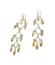 Load image into Gallery viewer, Silver earrings with yellow gemstones on a white wooden surface