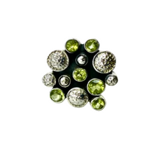 Load image into Gallery viewer, Ring with green gemstones on a white fabric background