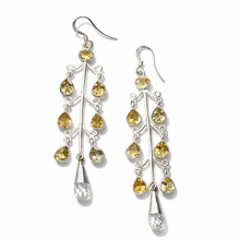 Load image into Gallery viewer, Silver earrings with yellow gemstones on a light gray background